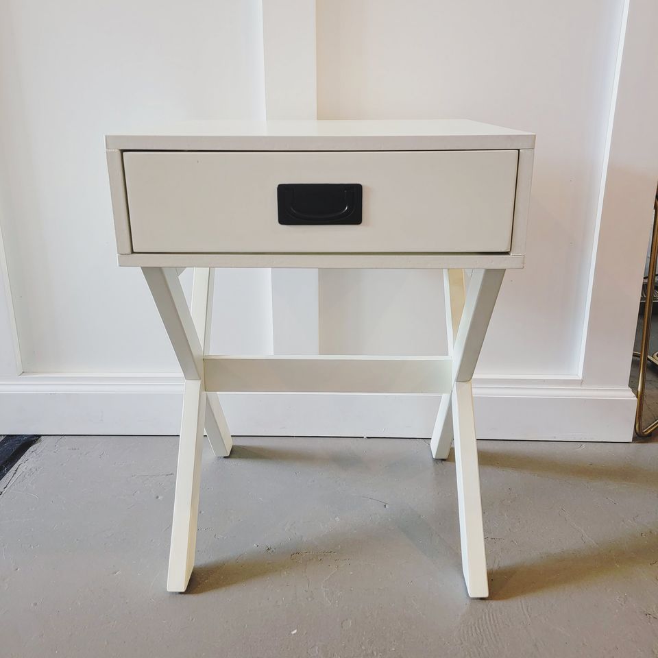 White X-shaped side table